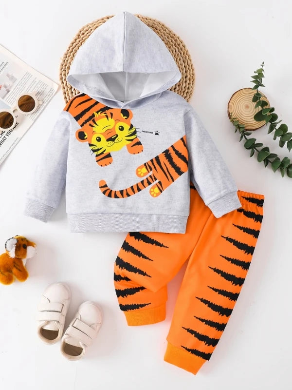 A cute two-piece set of cartoon tiger printed fleece with sweatshirt and sweatpants for baby boys and toddlers in spring and aut