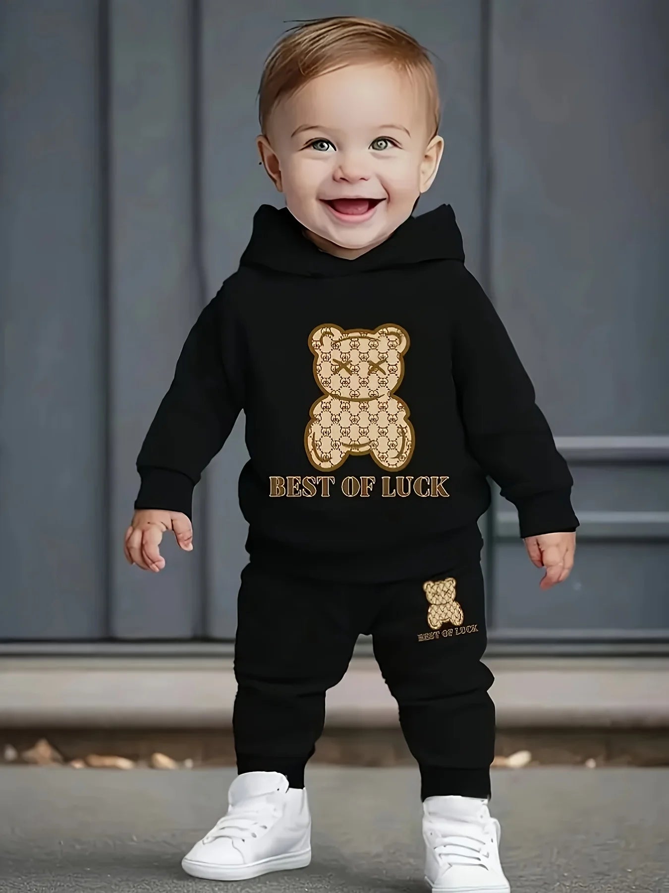 A two-piece cartoon printed fleece hoodie and long pants set for a newborn baby boy in autumn and winter