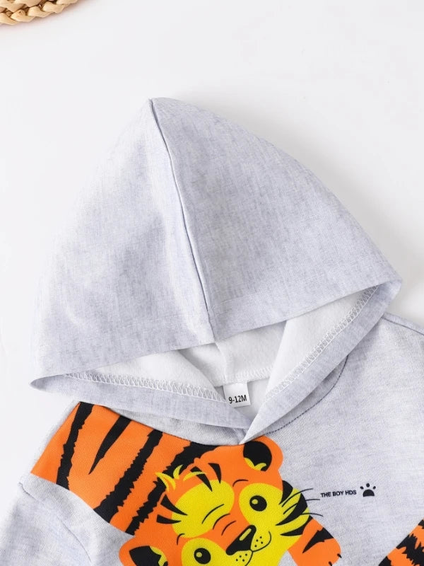 A cute two-piece set of cartoon tiger printed fleece with sweatshirt and sweatpants for baby boys and toddlers in spring and aut
